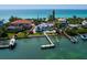 Stunning waterfront homes with private docks and beach access boast incredible views of the turquoise ocean waters at 1604 Casey Key Rd, Nokomis, FL 34275