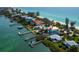 Breathtaking aerial view of waterfront homes along a stunning beach and the ocean at 1604 Casey Key Rd, Nokomis, FL 34275