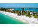 Beautiful beachfront property with lush landscaping and turquoise water at 1604 Casey Key Rd, Nokomis, FL 34275