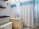 Bathroom with a vanity, mirror, and a shower-tub combo at 1604 Casey Key Rd, Nokomis, FL 34275