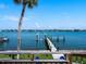 Dock view of a dock on calm waters with a distant shoreline at 1604 Casey Key Rd, Nokomis, FL 34275