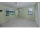 Well-lit bedroom with three windows and a spacious closet for ample storage at 1740 Chadwick Rd, Englewood, FL 34223