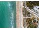 Breathtaking aerial view of the coastline showcasing the beach, parking, and pristine ocean, great for nature enthusiasts at 1871 Bridge St, Englewood, FL 34223