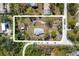 An aerial view of a property showcasing the home, surrounding landscape, and lot size at 1871 Bridge St, Englewood, FL 34223