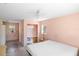 Bedroom needing some work showcasing peach walls, a bed, and built-in shelves at 1871 Bridge St, Englewood, FL 34223