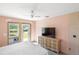 Bedroom needing some work showcasing peach walls, a bed, and exterior access at 1871 Bridge St, Englewood, FL 34223