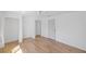 Unfurnished space with laminate floors, white walls, and a ceiling fan at 1871 Bridge St, Englewood, FL 34223