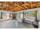 Spacious garage featuring exposed wood beams, large windows, and modern appliances at 1871 Bridge St, Englewood, FL 34223
