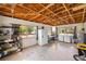 Spacious garage featuring exposed wood beams, laundry, and modern appliances at 1871 Bridge St, Englewood, FL 34223
