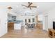 Spacious room showcases an open-concept layout with a modern kitchen and a dining area, brightened by natural light at 1871 Bridge St, Englewood, FL 34223
