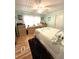 Inviting bedroom featuring a queen bed, a ceiling fan, and a dresser at 199 Palm Harbor Dr, North Port, FL 34287