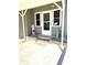 Charming entrance with a welcome sign and decorative elements on the porch at 199 Palm Harbor Dr, North Port, FL 34287