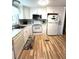 Well-equipped kitchen featuring modern appliances, ample cabinet space, and wood-look flooring for a warm feel at 199 Palm Harbor Dr, North Port, FL 34287