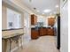 Well-appointed kitchen with stainless steel appliances, granite countertops, and ample cabinet space for storage at 20390 Cavallo Ct, Venice, FL 34292