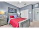 The bedroom has neutral walls and carpet, a ceiling fan, and two bedside tables at 2172 Chenille Ct, Venice, FL 34292