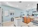 Bright, modern kitchen with stainless steel appliances, granite countertops, and a center island at 2172 Chenille Ct, Venice, FL 34292
