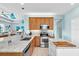 Bright kitchen with stainless steel appliances and an island with a butcher block top at 2172 Chenille Ct, Venice, FL 34292