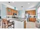Well-appointed kitchen with stainless appliances, granite countertops and a convenient breakfast bar at 2172 Chenille Ct, Venice, FL 34292
