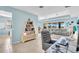 Spacious, open-concept area showcasing modern furnishings, natural light, and views of the outdoor space at 2172 Chenille Ct, Venice, FL 34292
