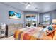 Spacious main bedroom with balcony access, desk, and ceiling fan at 2172 Chenille Ct, Venice, FL 34292