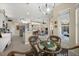 Open-concept kitchen and breakfast nook with granite countertops and view of the living area at 2175 Calusa Lakes Blvd, Nokomis, FL 34275