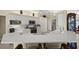 Spacious kitchen featuring a large island with seating and stainless steel appliances at 2175 Calusa Lakes Blvd, Nokomis, FL 34275