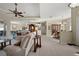 Spacious living room with open layout, tile floors, and views of the kitchen and dining areas at 2175 Calusa Lakes Blvd, Nokomis, FL 34275