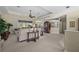 Comfortable living room with tile flooring, neutral tones, and views throughout the home at 2175 Calusa Lakes Blvd, Nokomis, FL 34275