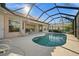 Screened-in pool with views of the golf course and lush landscaping at 2175 Calusa Lakes Blvd, Nokomis, FL 34275