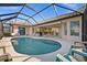 Inviting screened-in pool and patio area, perfect for outdoor entertaining and relaxation at 2175 Calusa Lakes Blvd, Nokomis, FL 34275