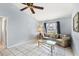 Bright bonus room with tile floors, a ceiling fan, and a large window at 221 Mark Twain Ln, Rotonda West, FL 33947