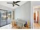 Bright breakfast nook with a view of the pool area, tile floors, and modern finishes at 221 Mark Twain Ln, Rotonda West, FL 33947