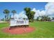 Rotonda Golf & Country Club community sign amidst a beautifully landscaped setting at 221 Mark Twain Ln, Rotonda West, FL 33947