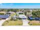 Charming single-story home featuring a two-car garage and well-manicured front lawn at 221 Mark Twain Ln, Rotonda West, FL 33947