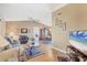 Bright living room featuring hardwood floors, neutral paint, and a view into the dining room at 221 Mark Twain Ln, Rotonda West, FL 33947