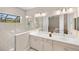 Modern bathroom with double sink vanity and glass enclosed shower at 228 Caserta Ct, North Venice, FL 34275