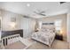 Bright bedroom with ceiling fan, complemented by stylish nautical décor at 228 Caserta Ct, North Venice, FL 34275