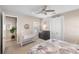 Bright bedroom with ceiling fan, complemented by stylish nautical décor at 228 Caserta Ct, North Venice, FL 34275