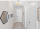Bright foyer with neutral walls, decorative mirrors, and stylish rug leading to other rooms at 228 Caserta Ct, North Venice, FL 34275