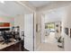 Hallway view to office space and living room with pool view at 228 Caserta Ct, North Venice, FL 34275