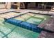 Close-up of a beautiful hot tub with stylish blue mosaic tiles and lush greenery at 228 Caserta Ct, North Venice, FL 34275