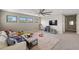 Bright loft area with three windows, sofa, and entertainment area for  at 228 Caserta Ct, North Venice, FL 34275