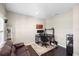 Comfortable office space with hardwood floors, a brown leather couch, and an executive desk setup at 228 Caserta Ct, North Venice, FL 34275