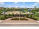 Neighborhood playground with shade, swings, a playground structure, and community mailboxes at 228 Caserta Ct, North Venice, FL 34275