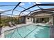 An inviting screened pool area with lounge chairs is perfect for relaxing in the sun at 228 Caserta Ct, North Venice, FL 34275