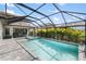 Resort-style pool with a luxurious hot tub and a spacious, screened patio area at 228 Caserta Ct, North Venice, FL 34275