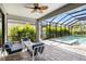 Screened in patio area with nice pool, hot tub, and patio furniture at 228 Caserta Ct, North Venice, FL 34275