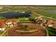 Aerial view of the beautiful community, showcasing the golf course, lakes, and manicured landscaping at 24036 Spartina Dr, Venice, FL 34293