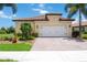 Charming single-story home featuring a tile roof, brick driveway, and well-maintained landscaping at 24036 Spartina Dr, Venice, FL 34293