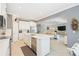 Well-lit kitchen with an island, stainless steel appliances, and open layout for modern living at 24036 Spartina Dr, Venice, FL 34293